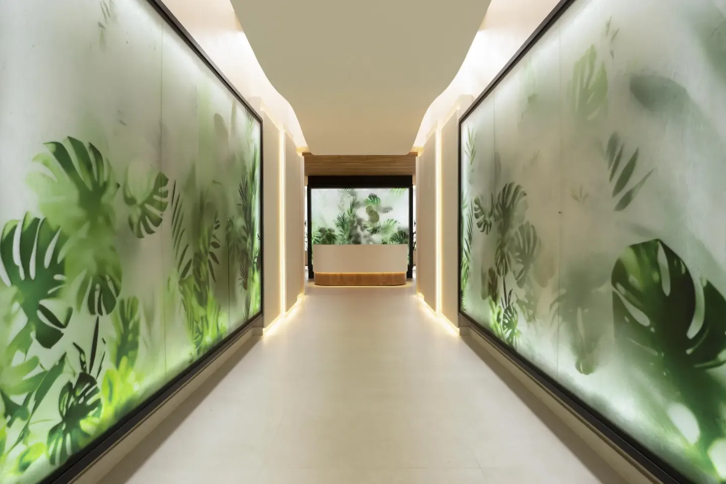 Spa corridor with illuminated tropical leaf panels at Hilton Aruba Caribbean Resort and Casino.