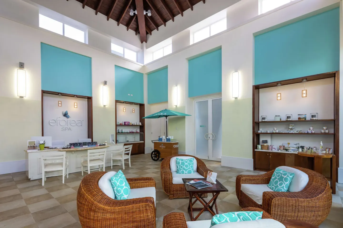 Spa reception lounge with wicker seating at Hilton Aruba Caribbean Resort and Casino.