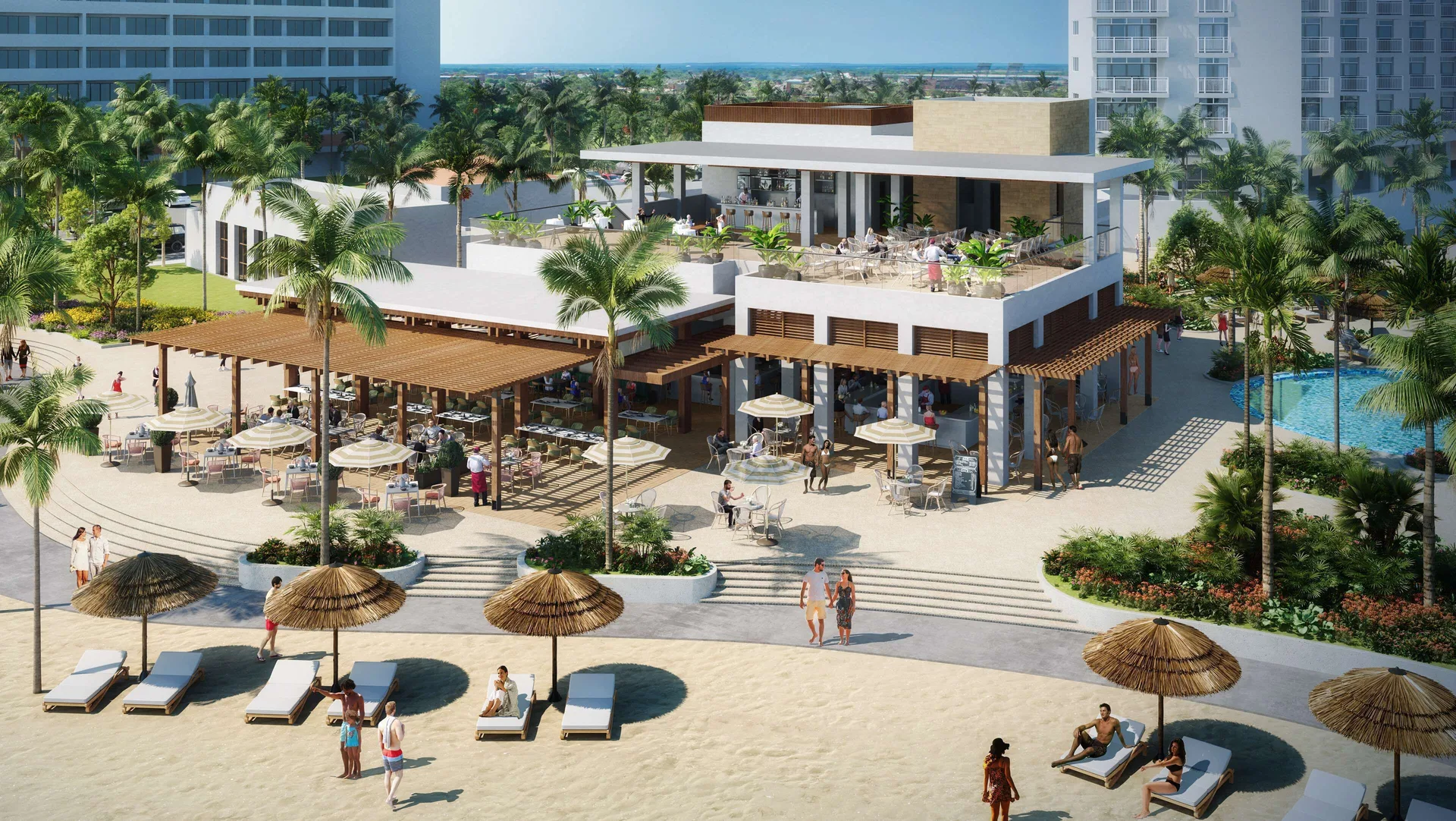 Beachfront resort building with dining terraces at Hilton Aruba Caribbean Resort and Casino.