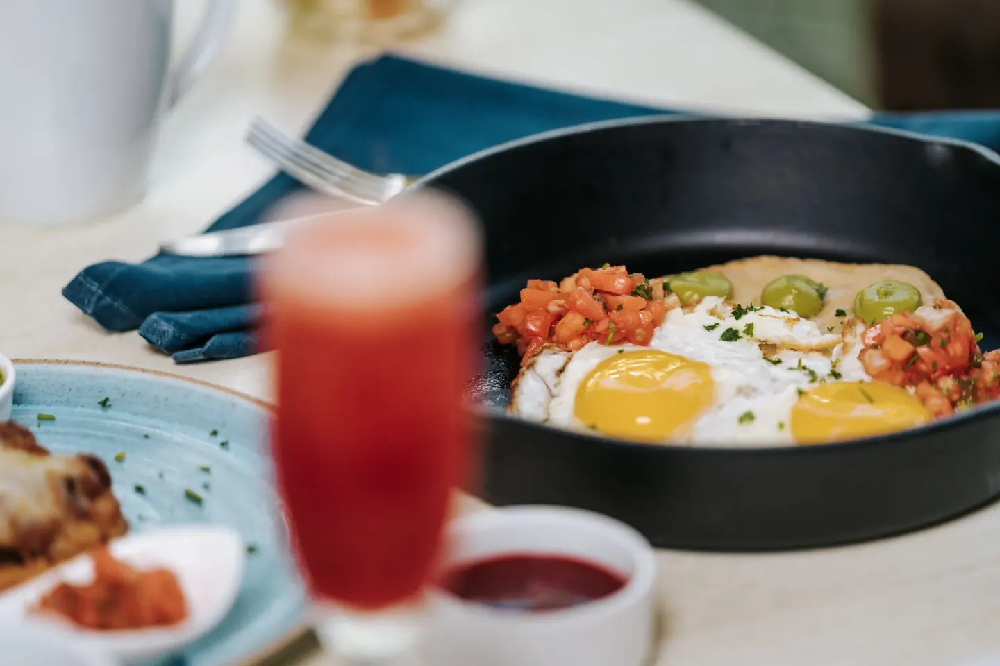 Skillet breakfast with eggs and a red drink at Hilton Aruba Caribbean Resort and Casino.