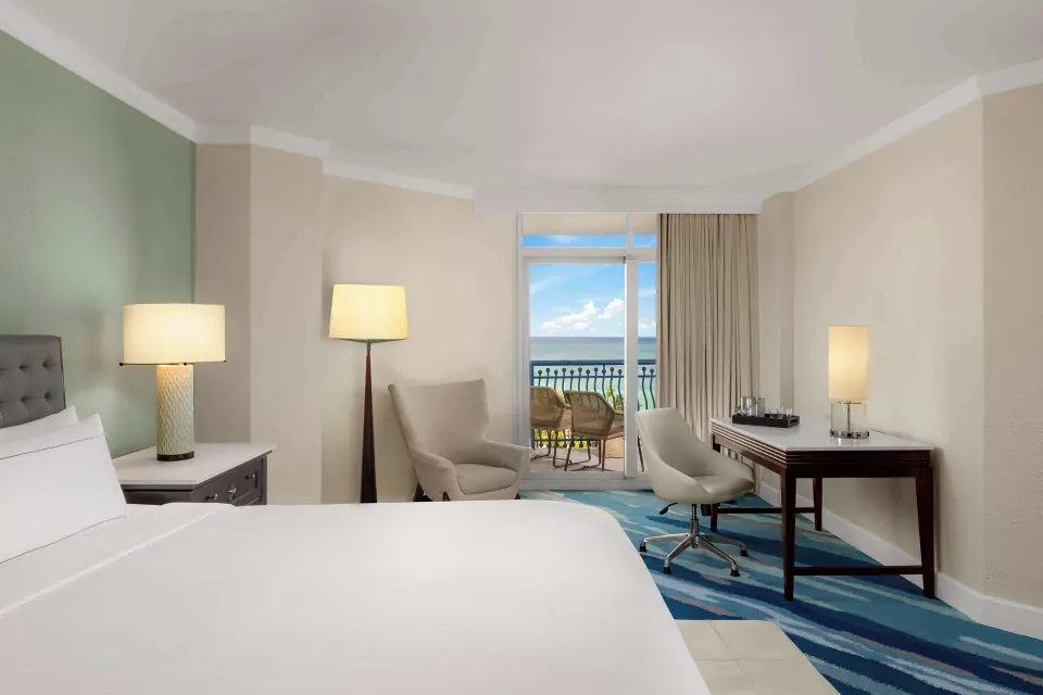 Club Room in the Aruba Tower with king bed and balcony at Hilton Aruba Caribbean Resort and Casino.