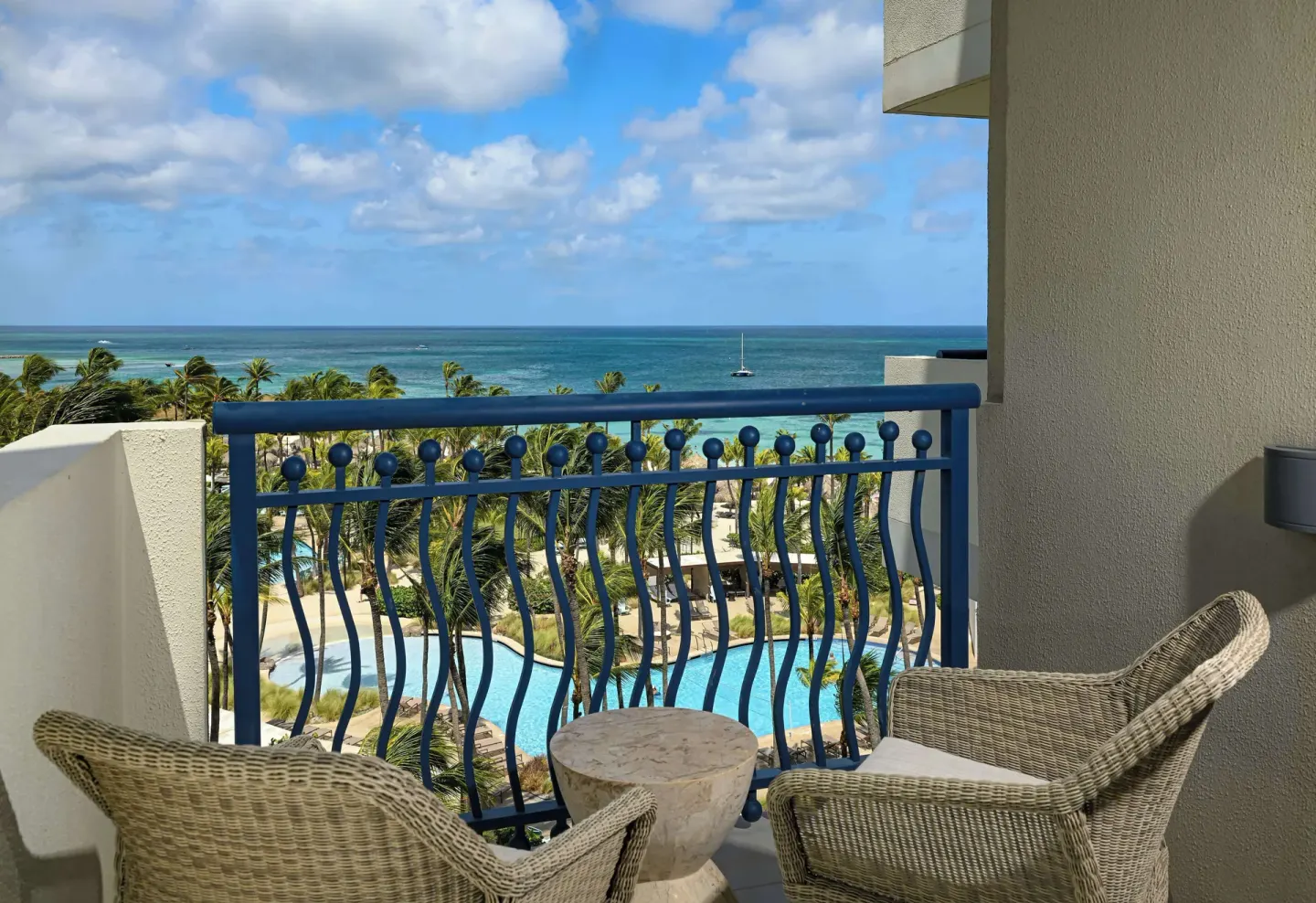 Ocean View balcony seating above the pool at Hilton Aruba Caribbean Resort and Casino.