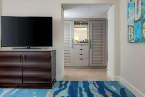 Palm Beach Club room television and closet alcove at Hilton Aruba Caribbean Resort and Casino.