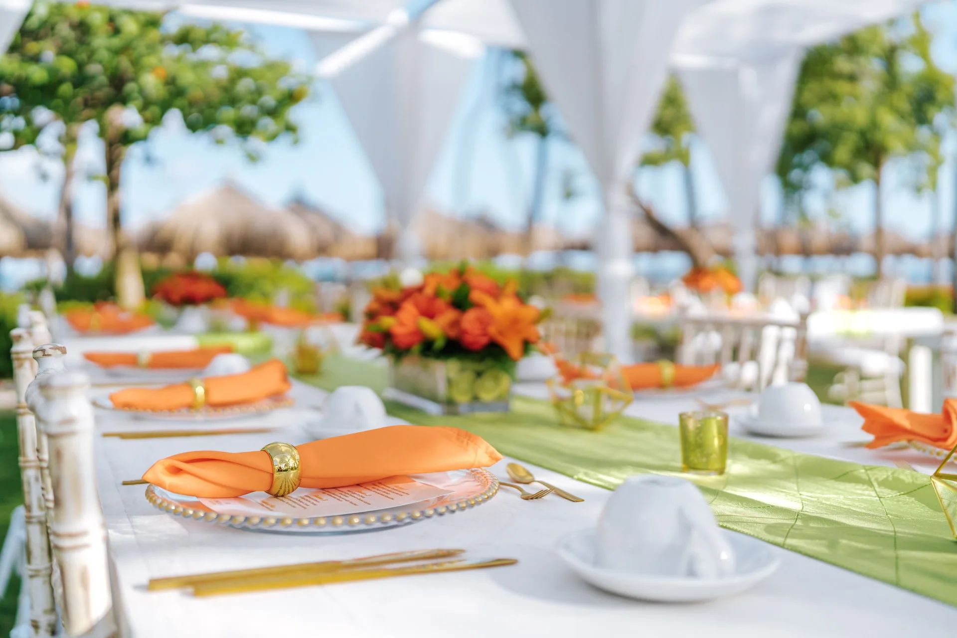 Outdoor event table with orange napkins at Hilton Aruba Caribbean Resort and Casino.