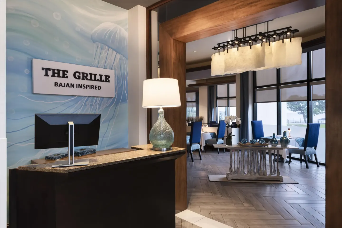 The Grille entrance sign and dining room at Hilton Barbados Resort.