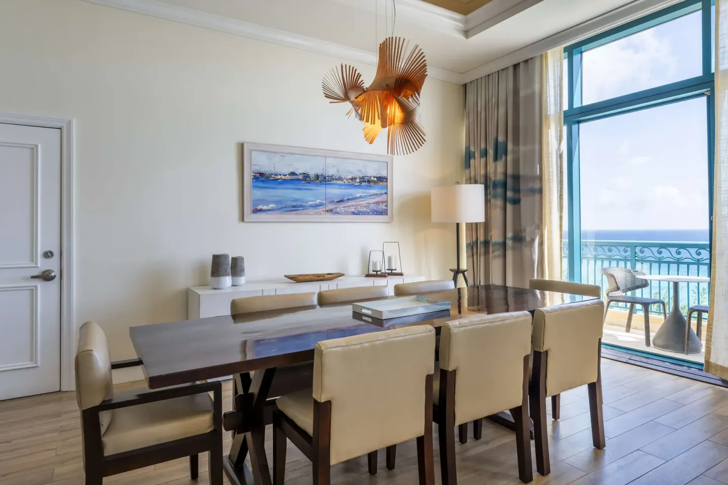 Premium suite dining area with balcony and ocean view at Hilton Barbados Resort.