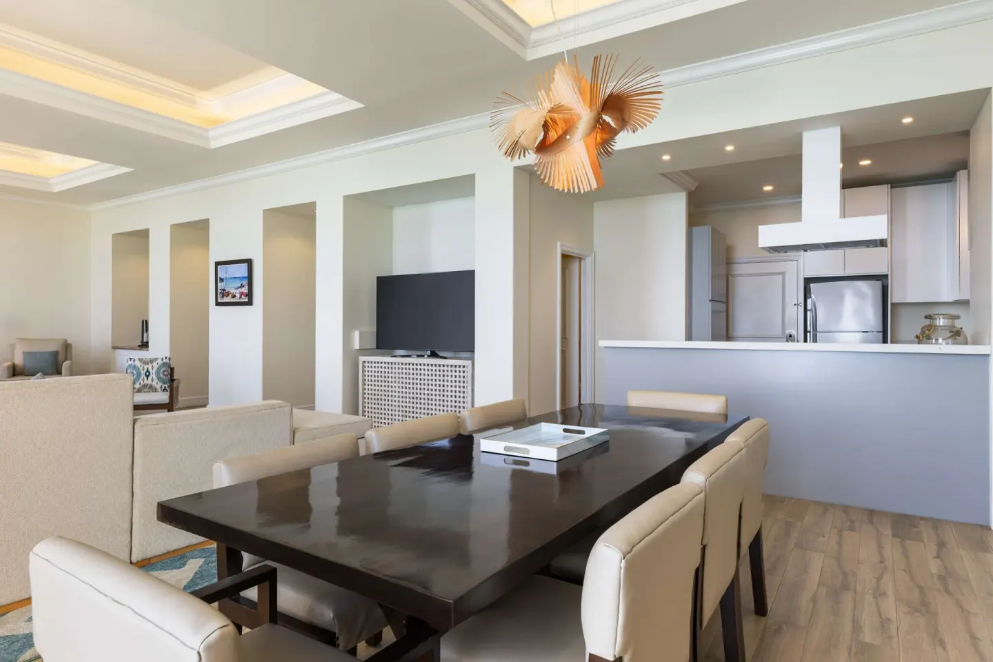 Premium suite dining and living area with open kitchen at Hilton Barbados Resort.