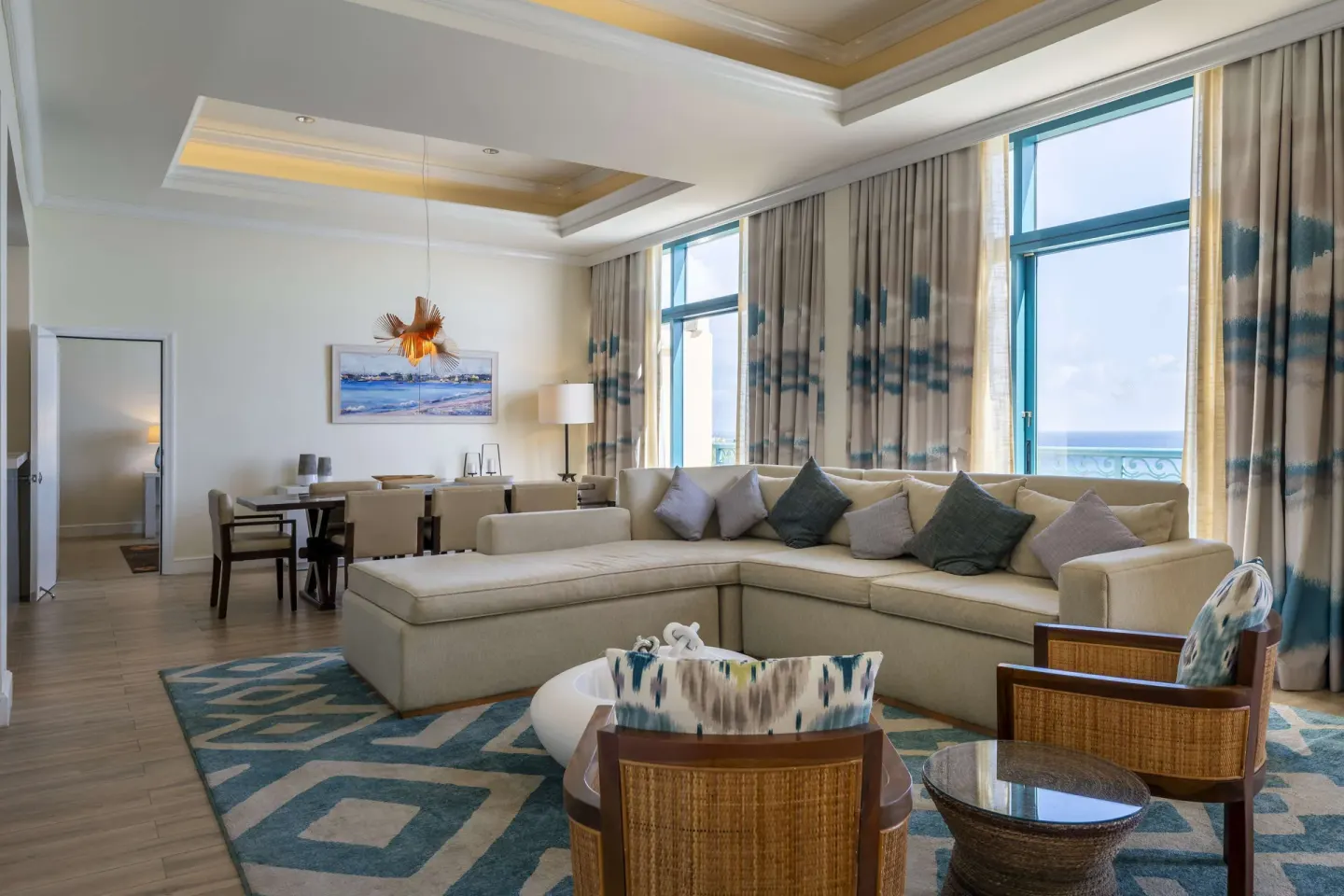 Premium Suite living room with ocean-facing windows at Hilton Barbados Resort.
