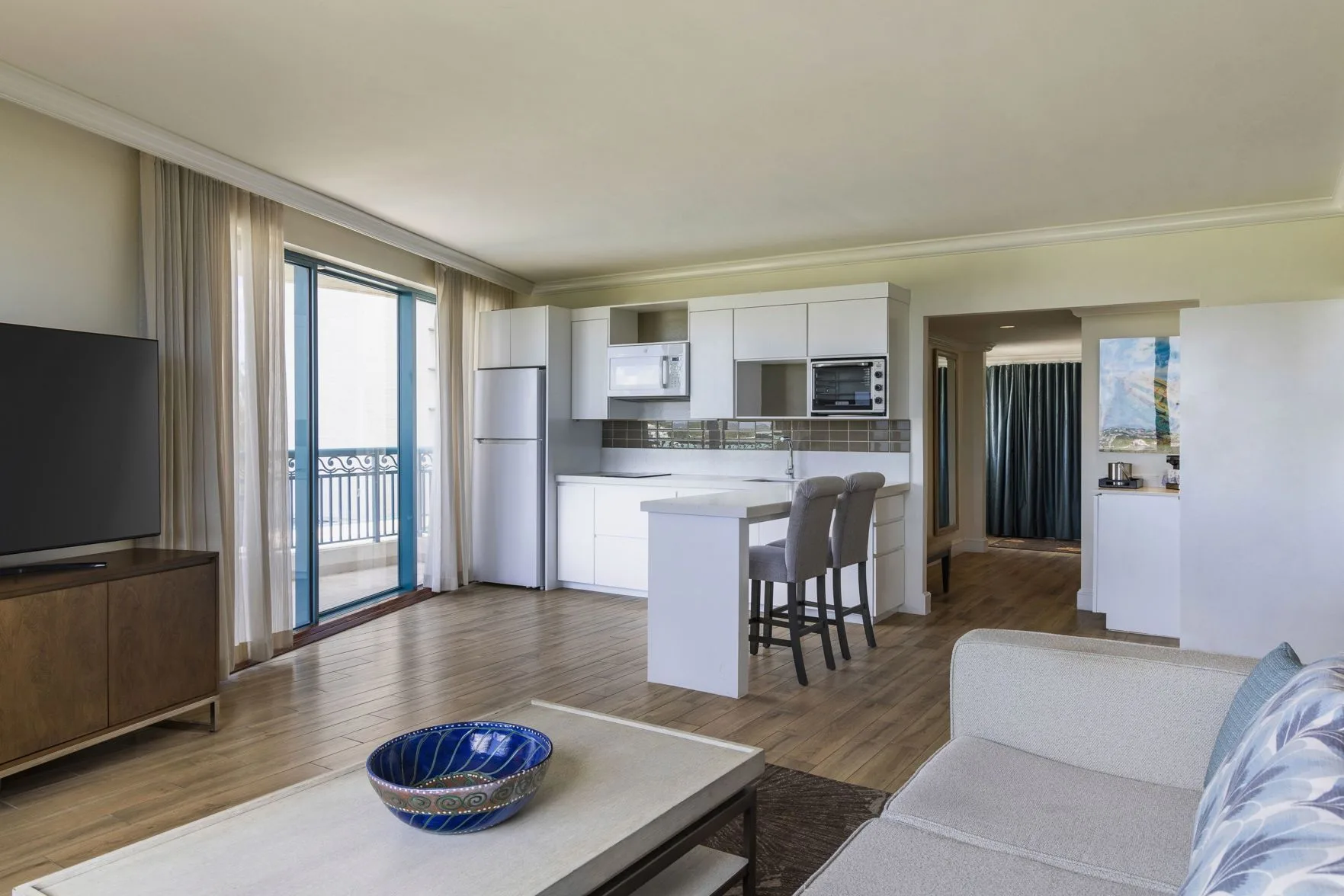 Residence 1 Bedroom Suite kitchenette and living area at Hilton Barbados Resort.
