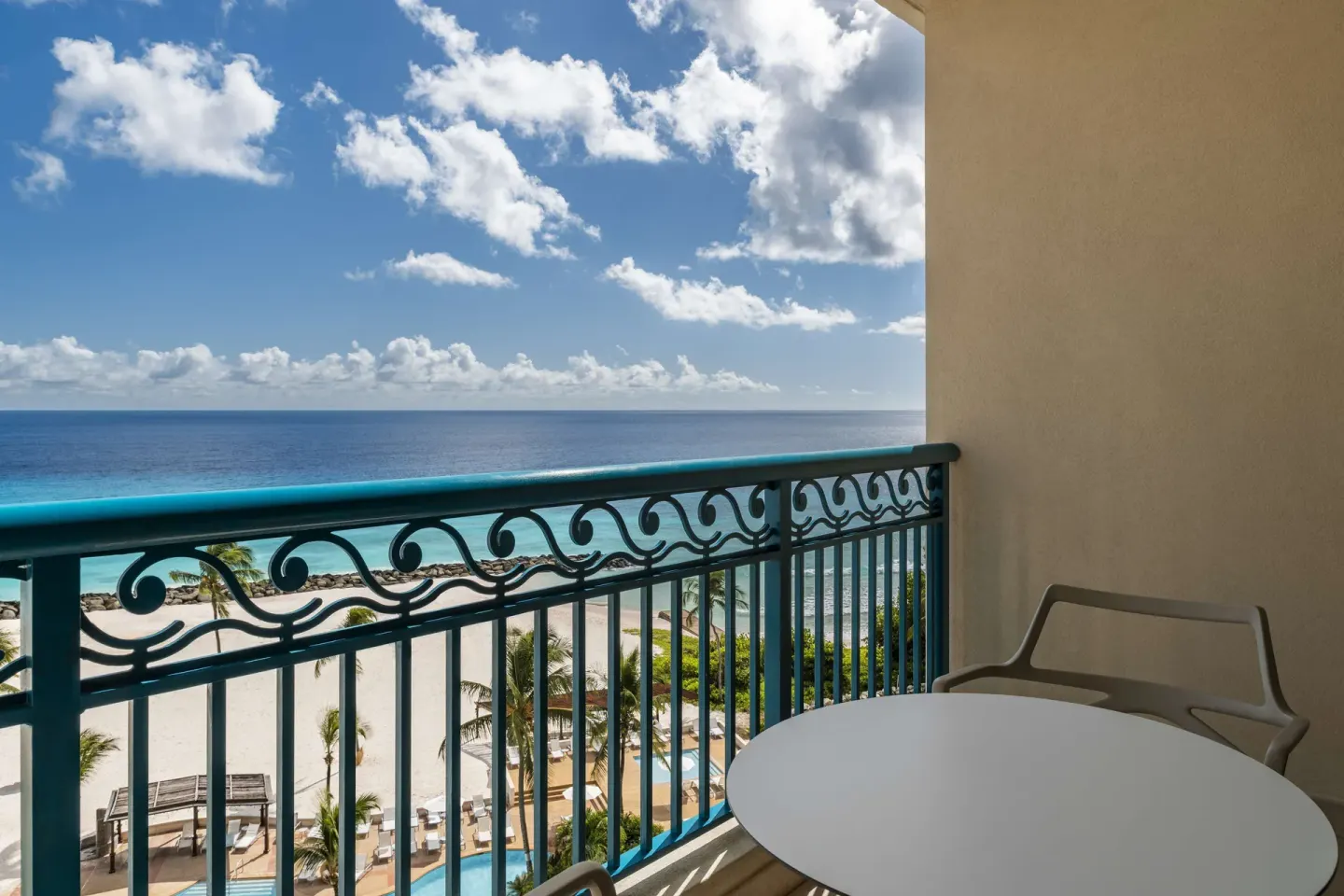 Accessible ocean view room balcony overlooking beach and sea at Hilton Barbados Resort.