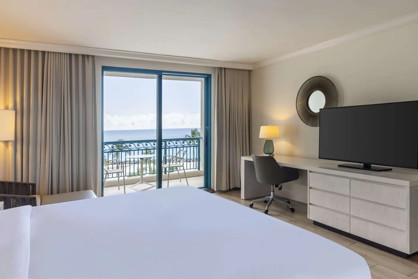 Accessible ocean view room with king bed and balcony at Hilton Barbados Resort.