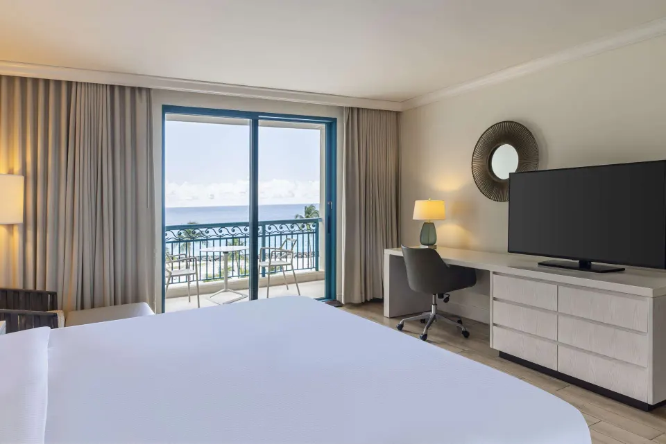 Accessible ocean view room with king bed and balcony at Hilton Barbados Resort.