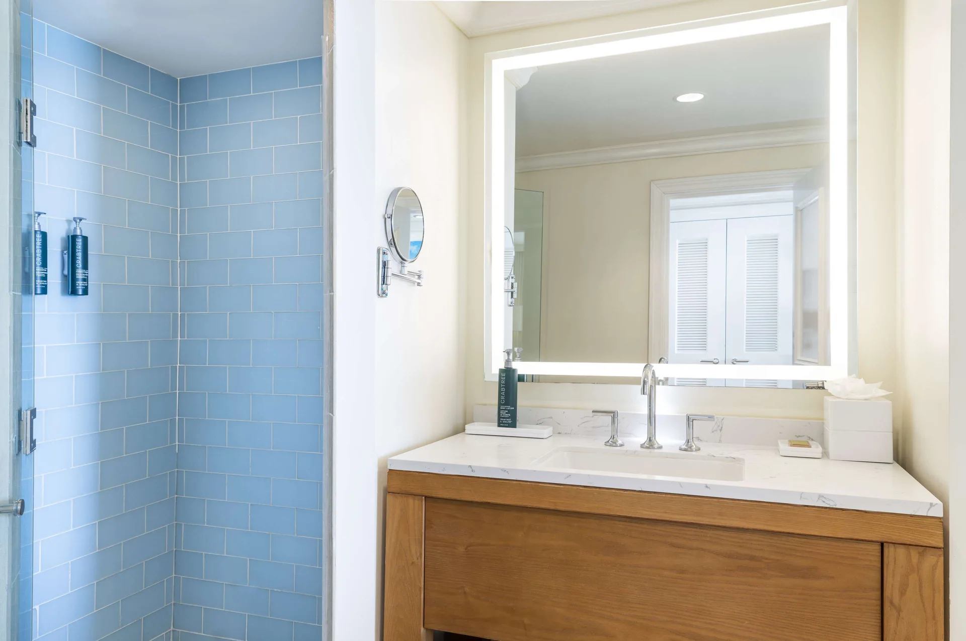Room Bay View bathroom at Hilton Barbados Resort with blue-tile shower and single vanity.