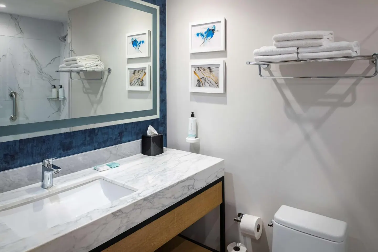 Guest bathroom vanity with towel shelf at Hilton Garden Inn Cancun Airport.