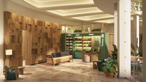 Reception desk and market area in the lobby at Hilton Garden Inn Cancun Airport.