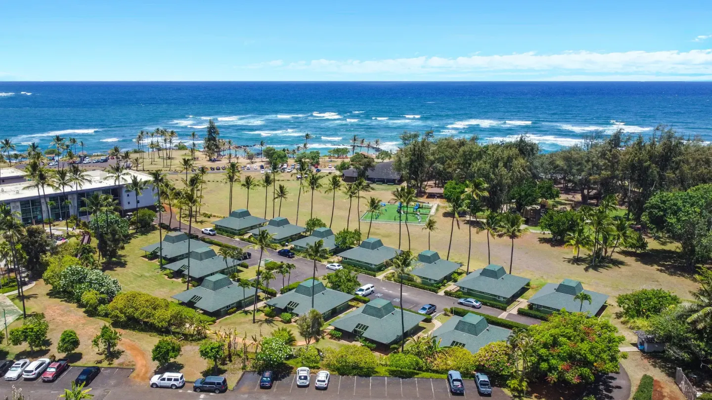 Aerial view of the oceanfront grounds at Hilton Garden Inn Kauai Wailua Bay.