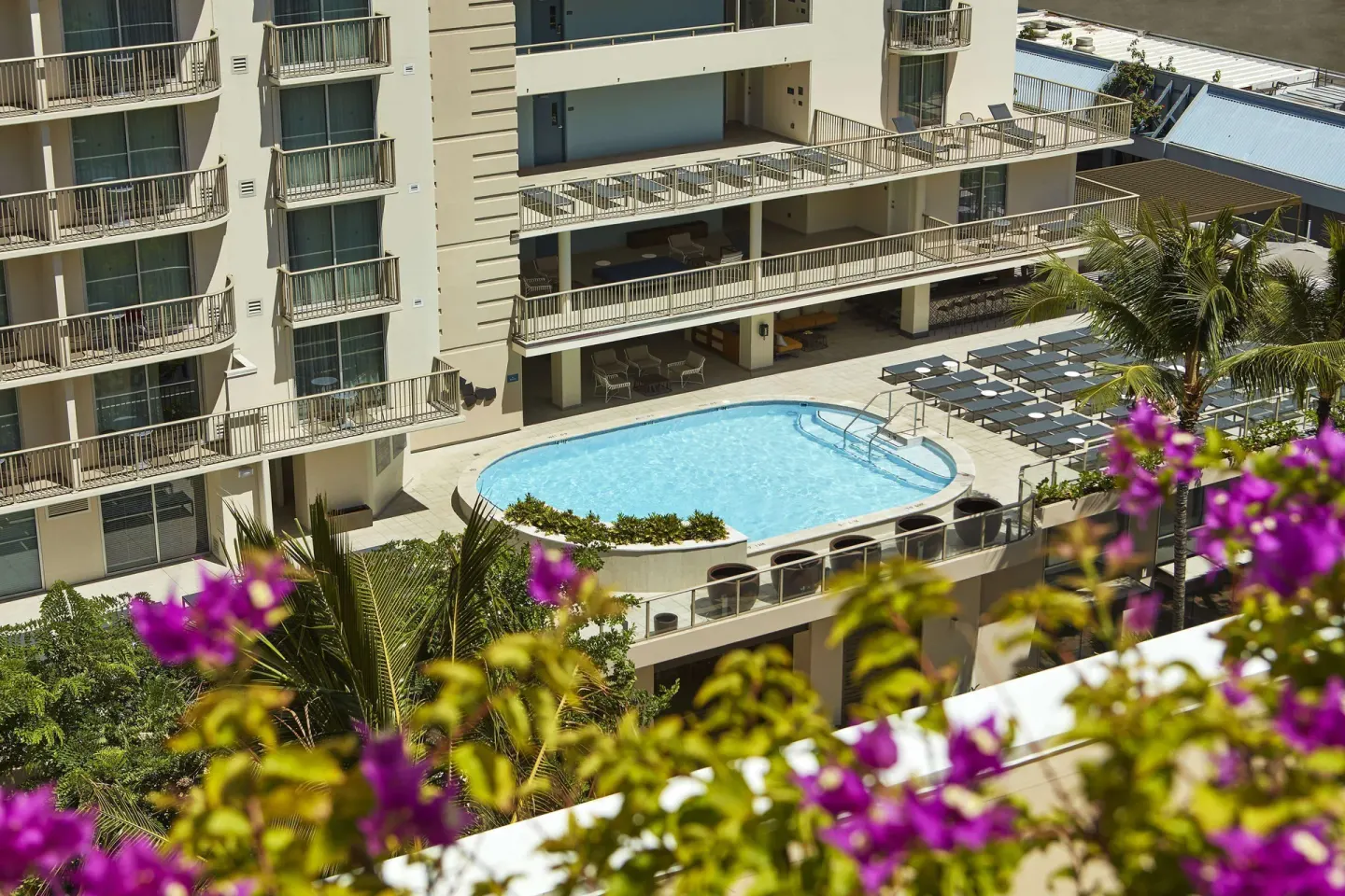Balcony view of the pool courtyard at Hilton Garden Inn Waikiki Beach.