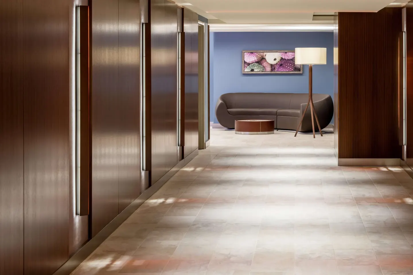 Elevator corridor with lounge seating at Hilton Garden Inn Waikiki Beach.