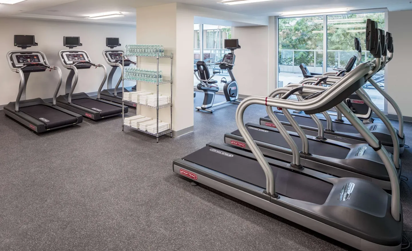 Fitness center with treadmills and cardio machines at Hilton Garden Inn Waikiki Beach.