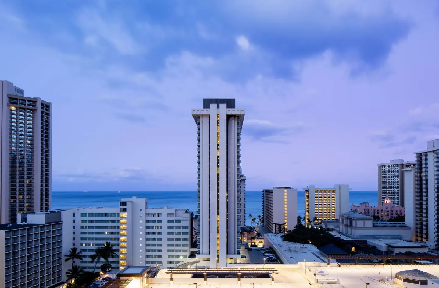 Waikiki skyline and ocean view near Hilton Garden Inn Waikiki Beach at dusk.