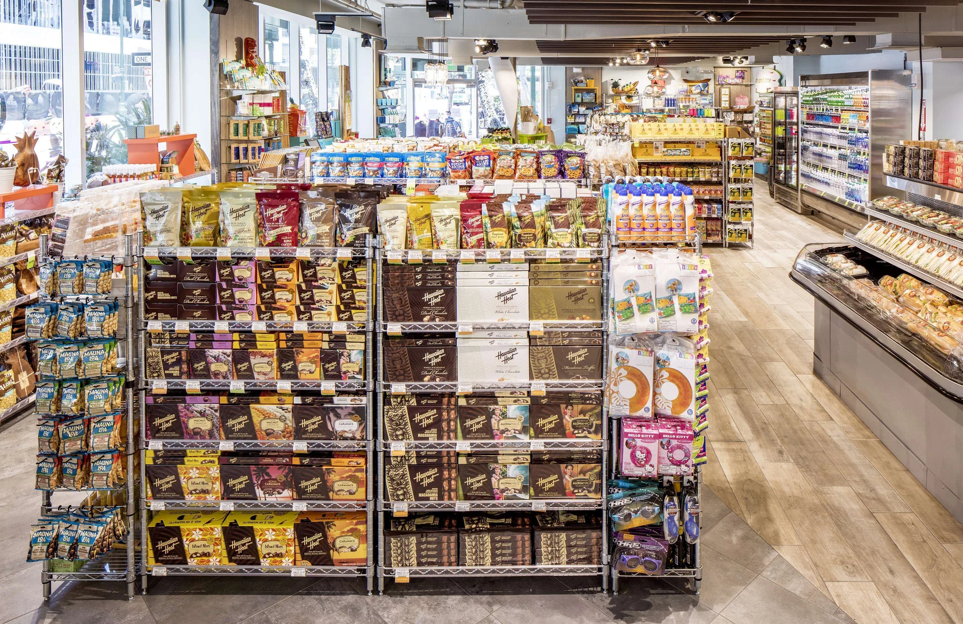 Market shelves with snacks and refrigerated cases at Hilton Garden Inn Waikiki Beach.