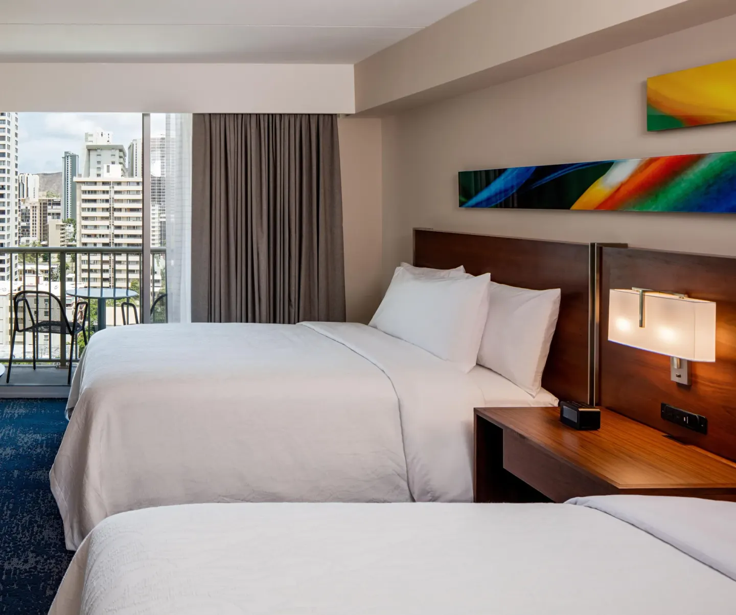 Accessible hearing room with two beds and balcony at Hilton Garden Inn Waikiki Beach.