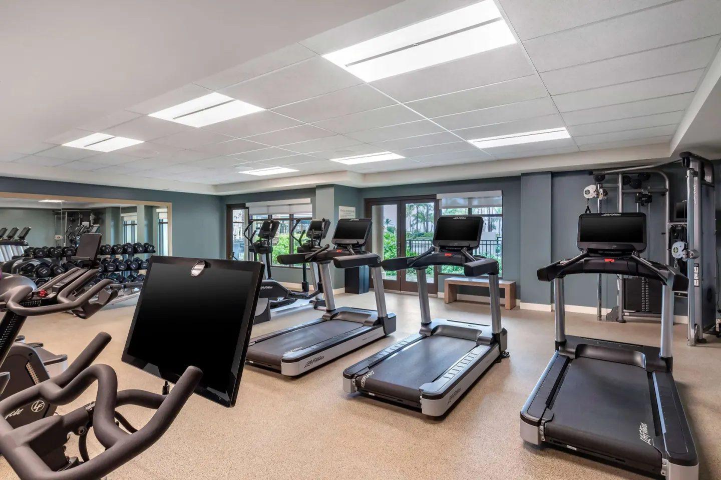 Fitness center with treadmills and weights at Hilton Grand Vacations Club Maui Bay Villas.
