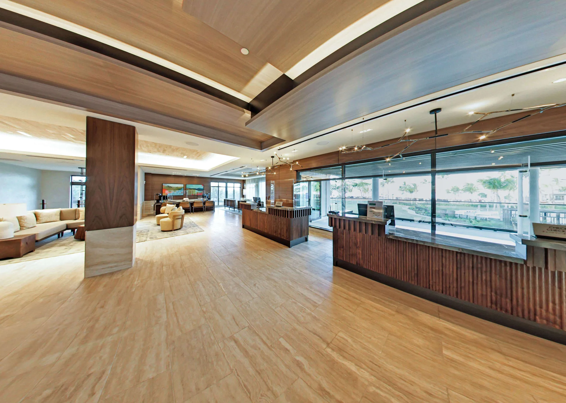 Lobby check-in counters and lounge seating at Hilton Grand Vacations Club Maui Bay Villas.