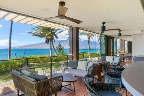 Covered oceanfront terrace seating at Hilton Grand Vacations Club Maui Bay Villas.