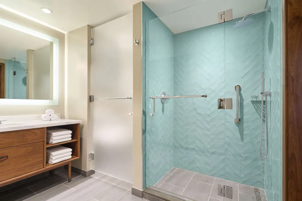 Suite bathroom with glass shower at Hilton Grand Vacations Club Maui Bay Villas.
