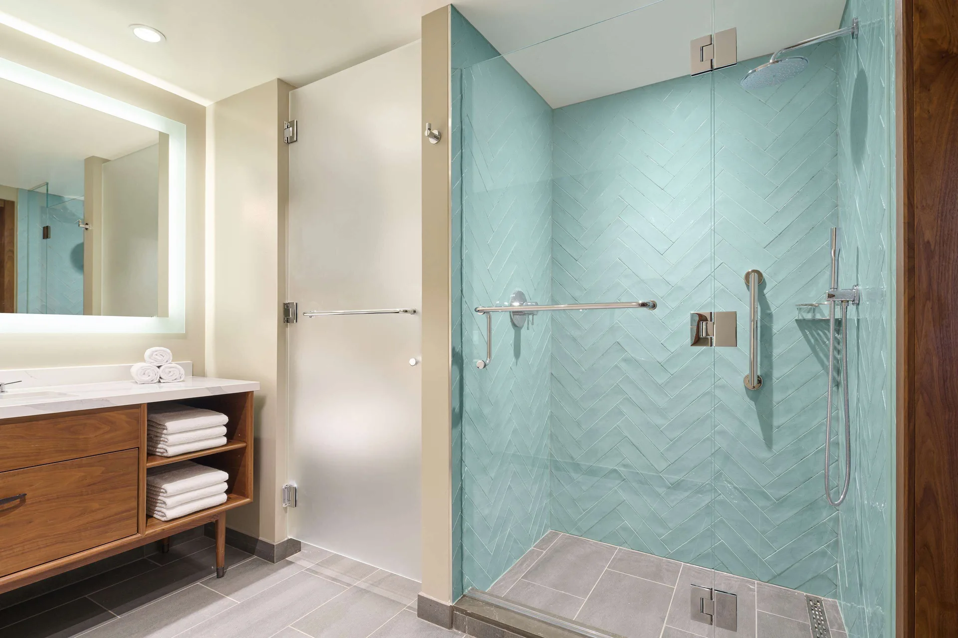 Suite bathroom with glass shower at Hilton Grand Vacations Club Maui Bay Villas.