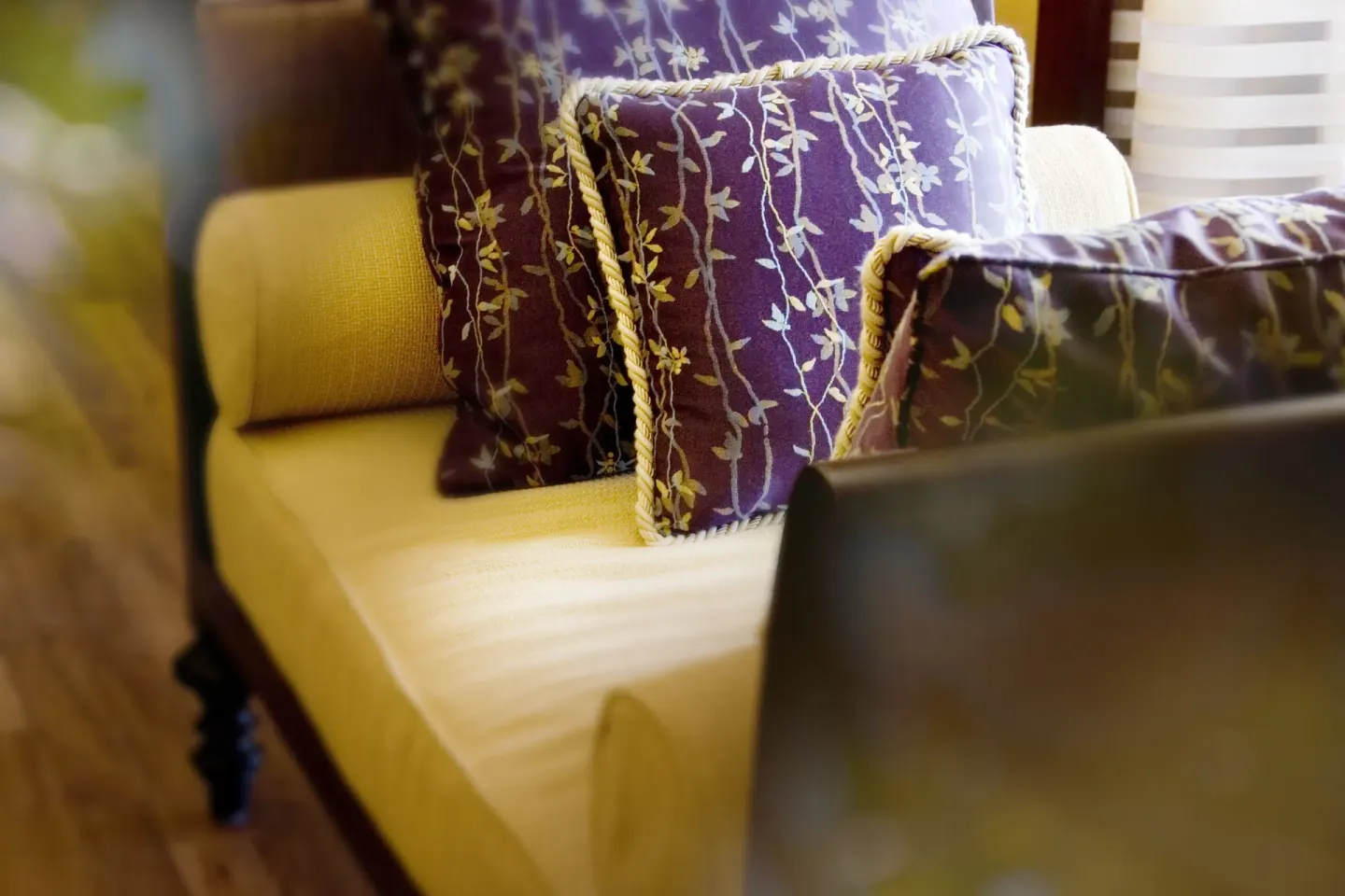 Close-up of floral pillows on a cushioned seat at Hilton Hawaiian Village Waikiki Beach Resort.