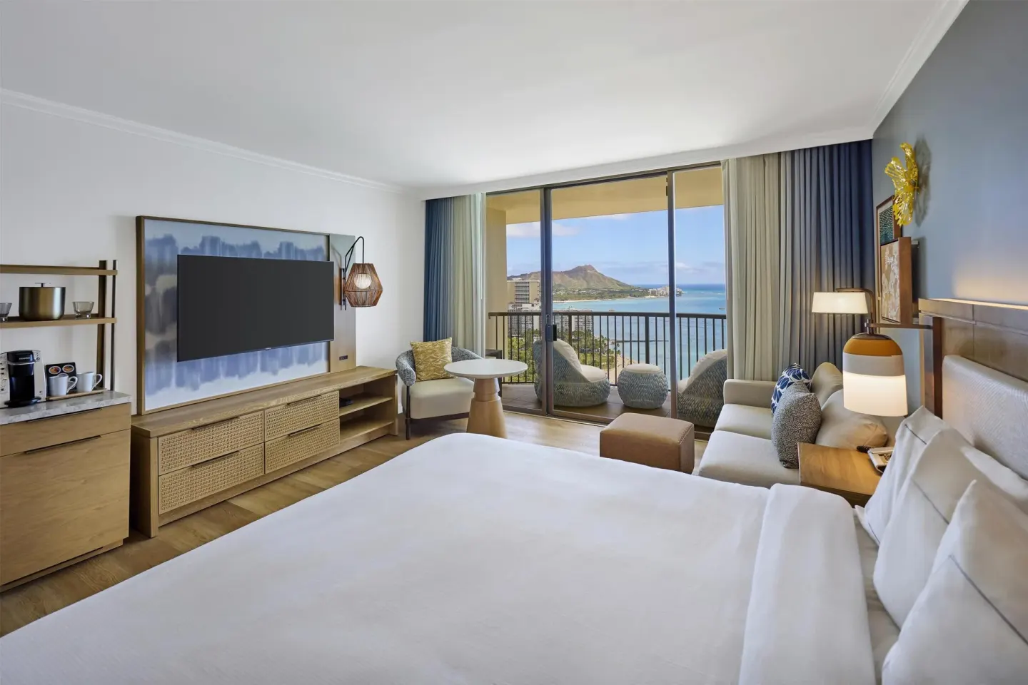 King guest room with ocean and Diamond Head view at Hilton Hawaiian Village Waikiki Beach Resort.