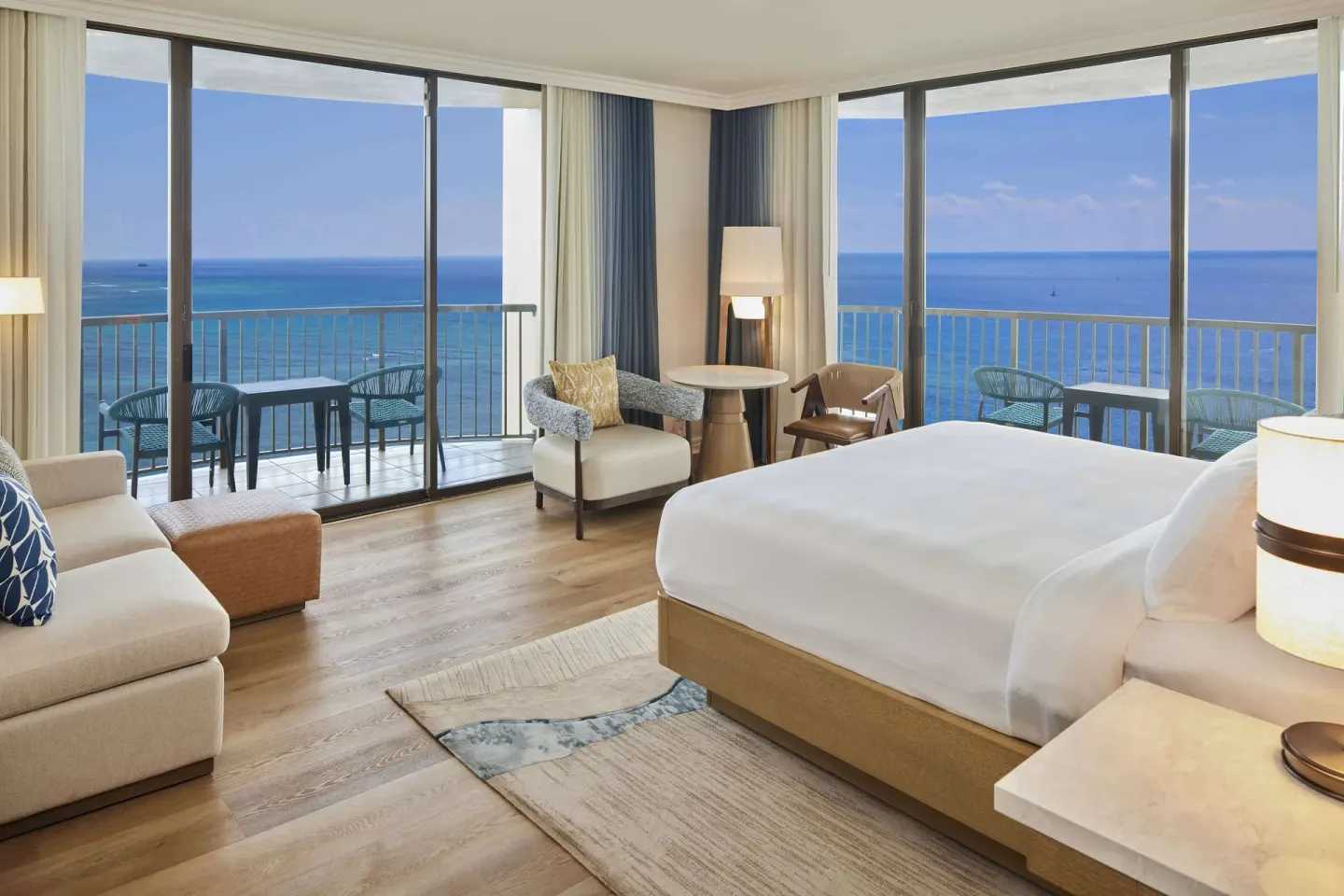 Oceanfront king guest room with two balconies at Hilton Hawaiian Village Waikiki Beach Resort.