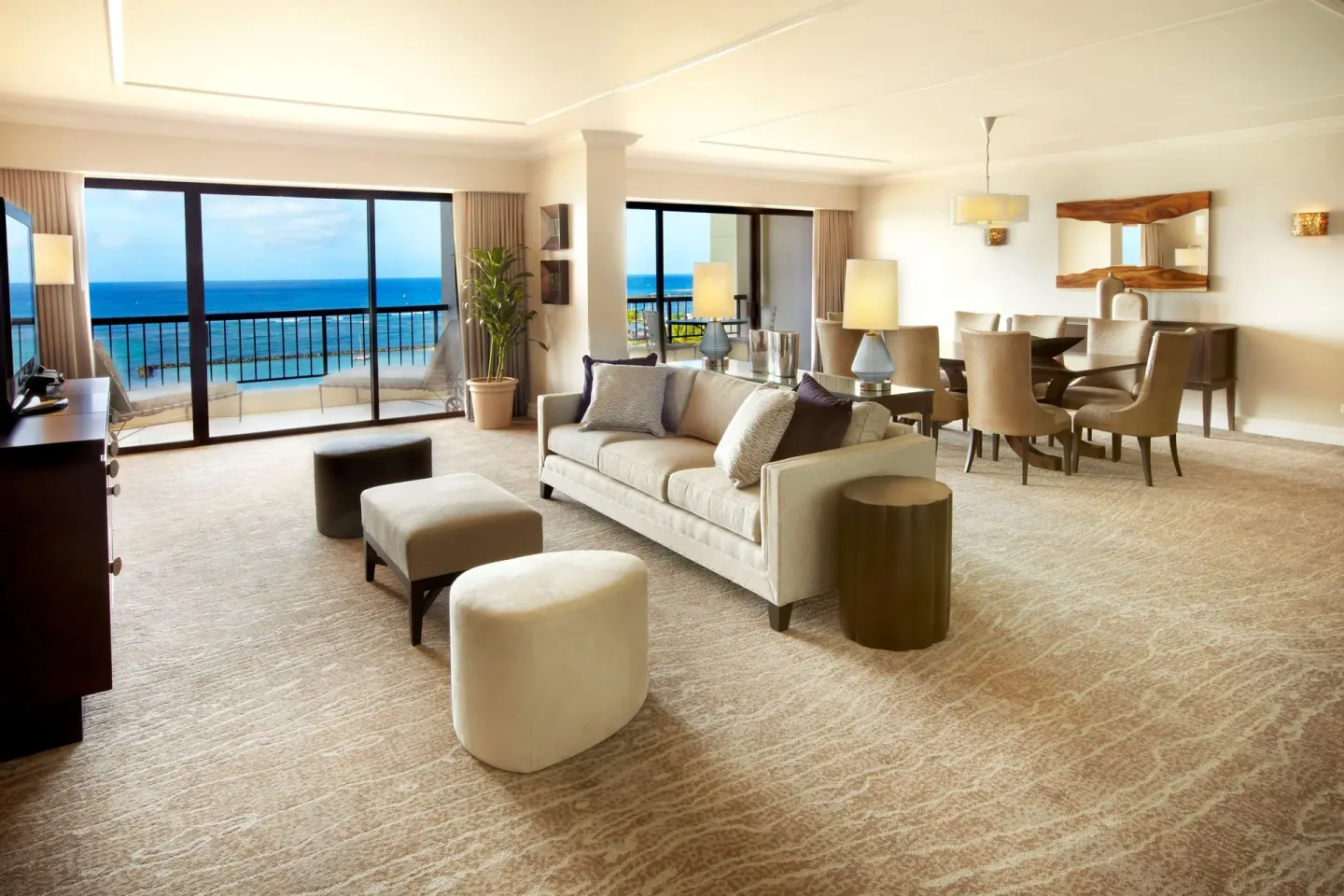 Oceanfront suite living and dining area at Hilton Hawaiian Village Waikiki Beach Resort.