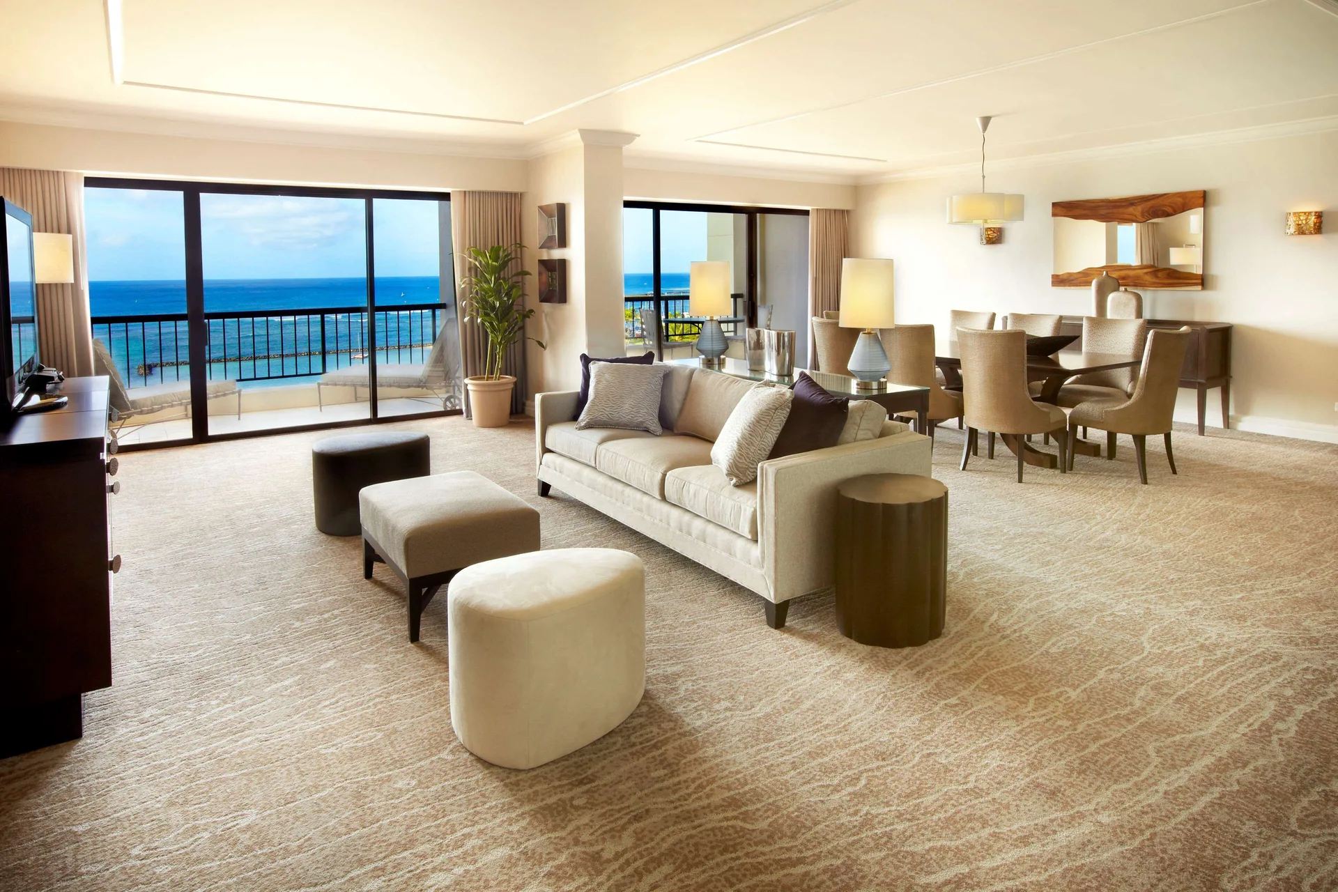 Oceanfront suite living and dining area at Hilton Hawaiian Village Waikiki Beach Resort.