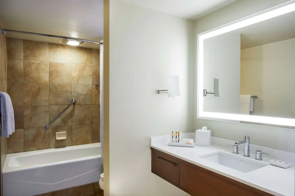 Family Room bathroom vanity and tub at Hilton Hawaiian Village Waikiki Beach Resort.