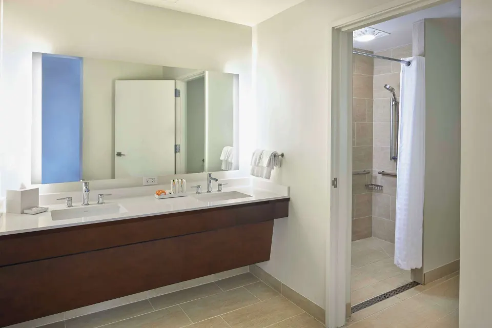 Accessible bathroom vanity and roll-in shower at Hilton Hawaiian Village Waikiki Beach Resort.