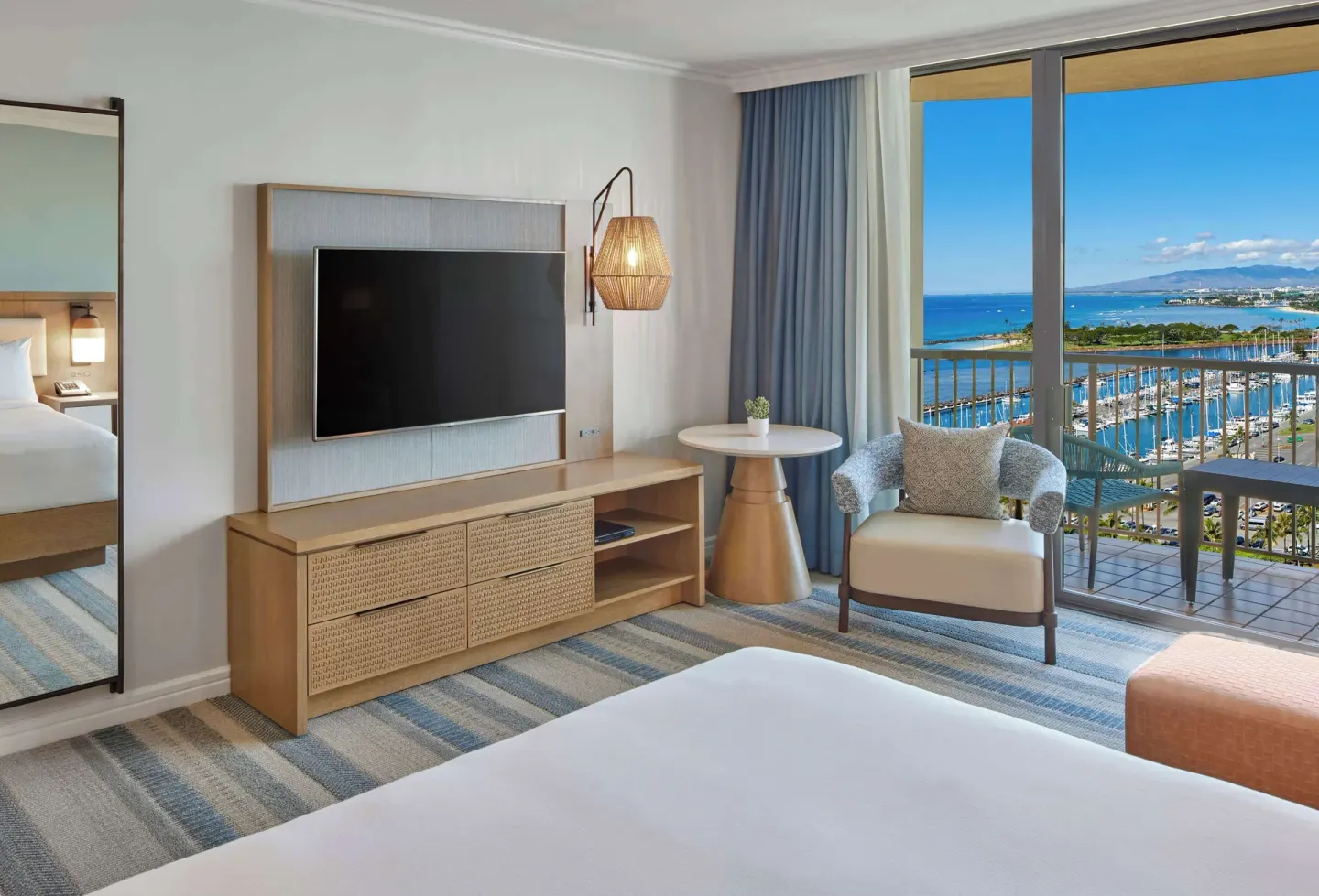 Renovated Rainbow Tower ocean view room with balcony at Hilton Hawaiian Village Waikiki Beach Resort.