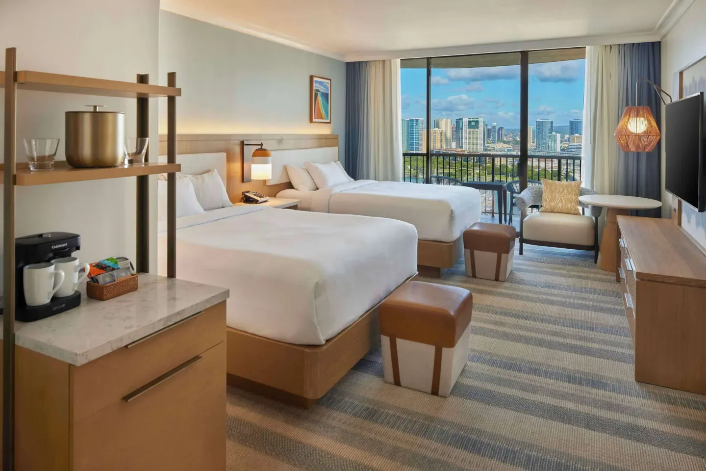 Two-bed renovated ocean view room at Hilton Hawaiian Village Waikiki Beach Resort with balcony and skyline view.