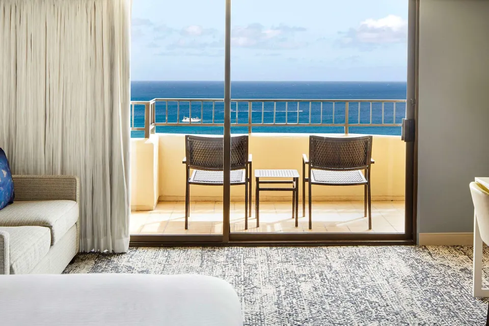 Ocean view balcony seen from a guest room at Hilton Hawaiian Village Waikiki Beach Resort.