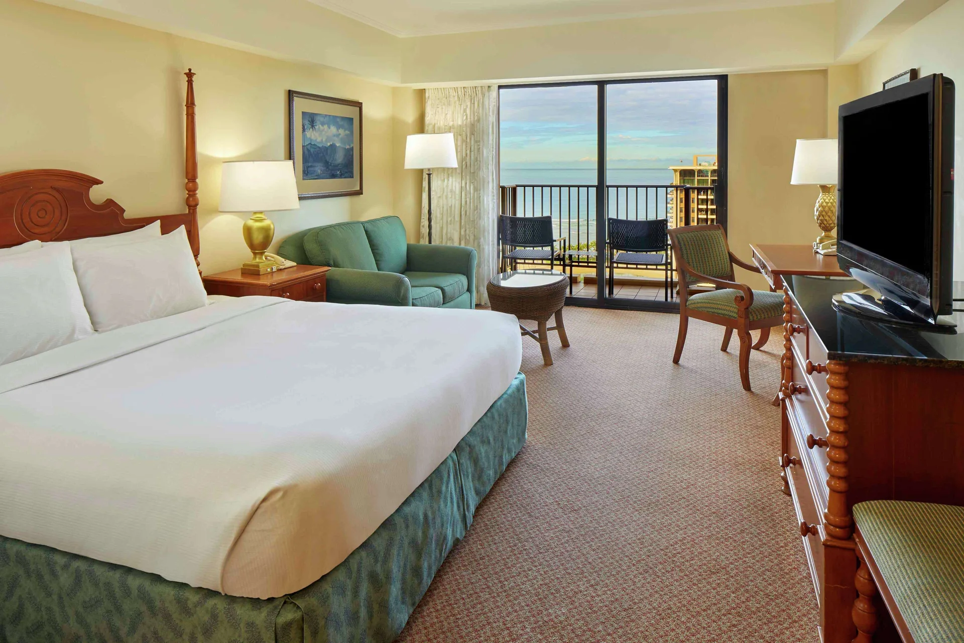 King Ocean View room with sofa and balcony at Hilton Hawaiian Village Waikiki Beach Resort.