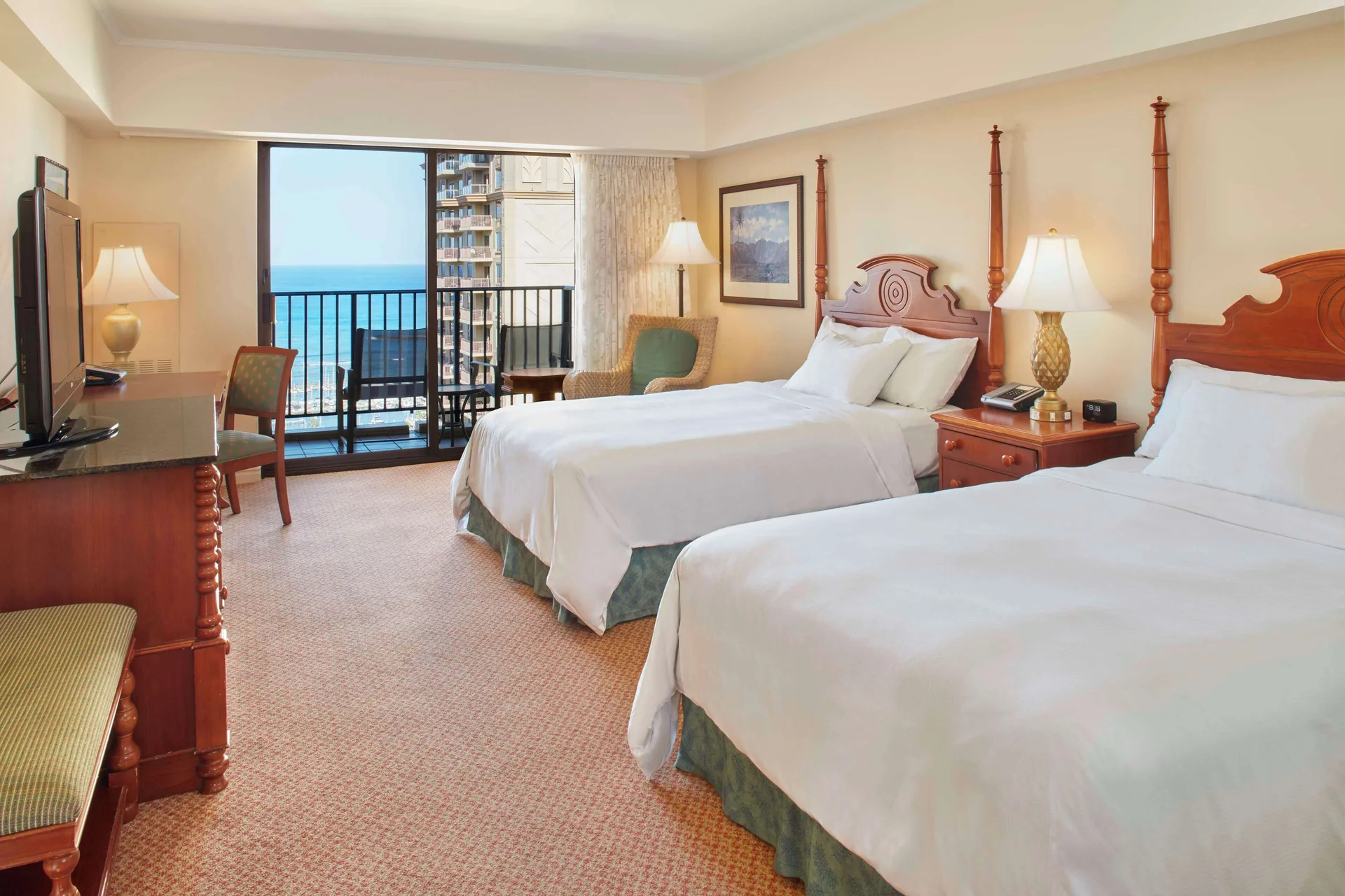 Two-bed Ocean View room with wood furniture at Hilton Hawaiian Village Waikiki Beach Resort.