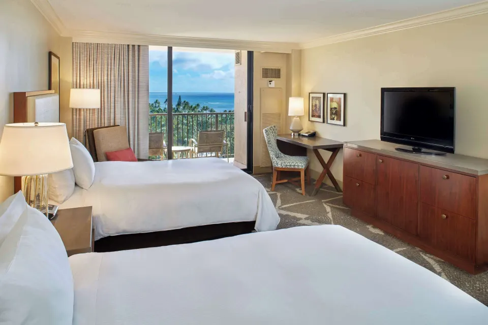 Two-bed Ocean View room with work desk and balcony at Hilton Hawaiian Village Waikiki Beach Resort.
