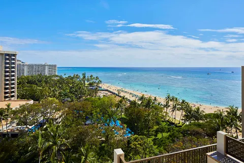 Balcony view of Waikiki Beach and the ocean at Hilton Hawaiian Village Waikiki Beach Resort.