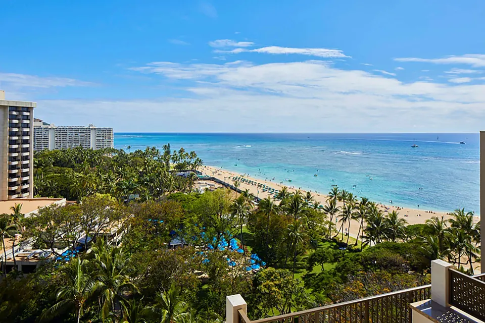 Balcony view of Waikiki Beach and the ocean at Hilton Hawaiian Village Waikiki Beach Resort.