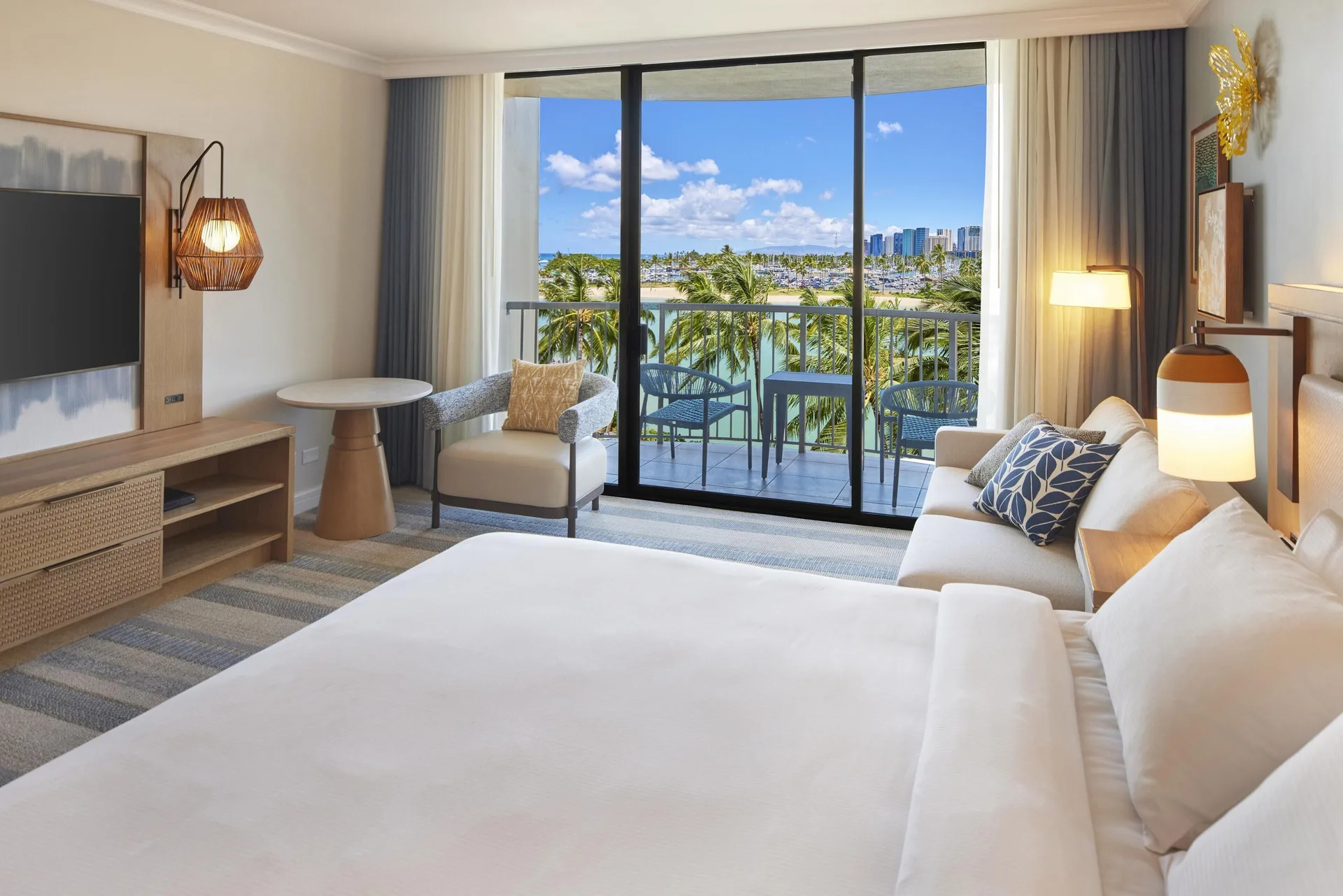 Room Partial Ocean View Rainbow Tower Renovated with king bed and lagoon view at Hilton Hawaiian Village Waikiki Beach Resort.