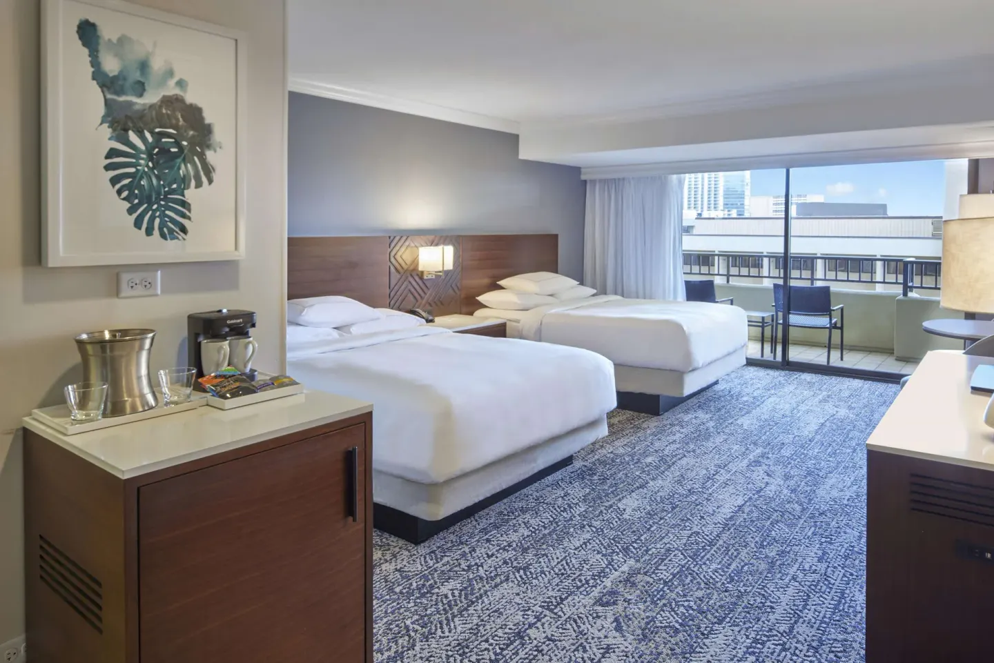 Two-bed resort view guest room with balcony at Hilton Hawaiian Village Waikiki Beach Resort.