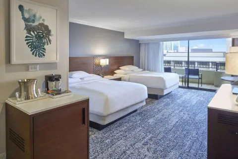 Two-bed resort view guest room with balcony at Hilton Hawaiian Village Waikiki Beach Resort.