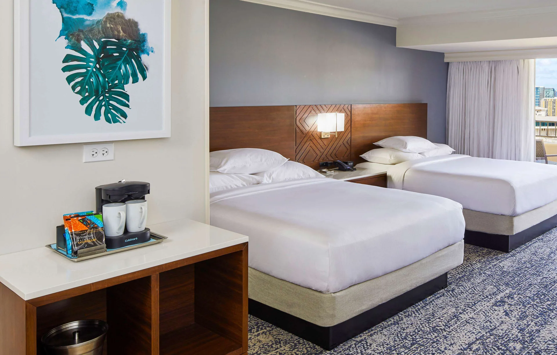 Two-bed Tapa Collection room with beverage station at Hilton Hawaiian Village Waikiki Beach Resort.